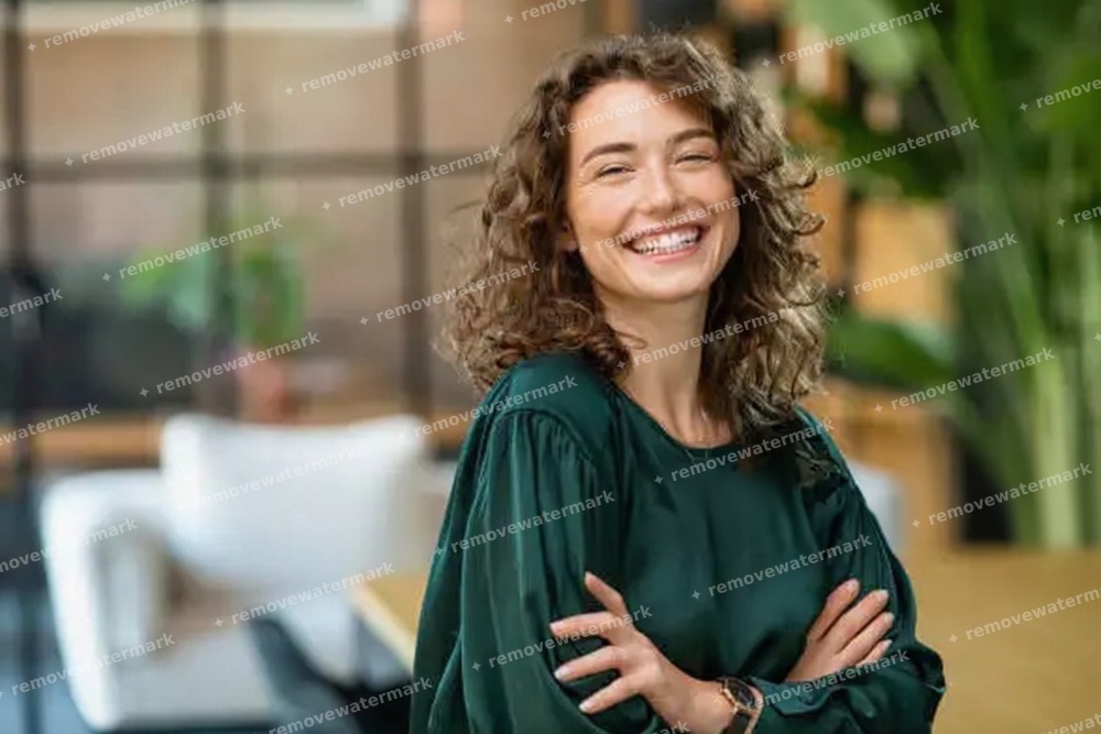 Manual brush removing a watermark from a photo